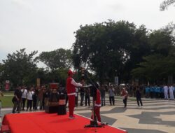 Warga Sambut Antusias Kirab Api PON Ke XXI Aceh Sumut di Kota Langsa