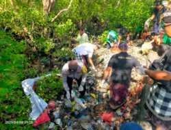Bhabinkamtibmas Benoa Gelar Aksi Bersih-Bersih Rawa di Jalan Pintas Lagun Nusa Dua