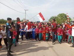 Semangat Merdeka! Kapolsek Kerumutan Pimpin Langsung Pembukaan Gerak Jalan di Kopau