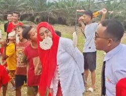 Aksi Kocak Kades Tanjung Beringin dan Istri di Lomba Makan Kerupuk HUT RI ke-80