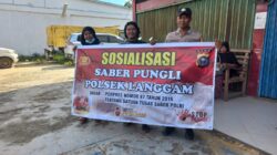 Polsek Langgam Sosialisasikan Saber Pungli kepada Warga di Pasar Desa Segati