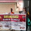 Polisi Gencarkan Sosialisasi Saber Pungli di Pasar Desa Segati Pelalawan