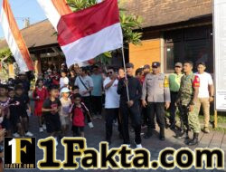 Jelang HUT RI ke-81, Babinsa Desa Penarukan Hadir Pastikan Jalan Sehat Berjalan Aman